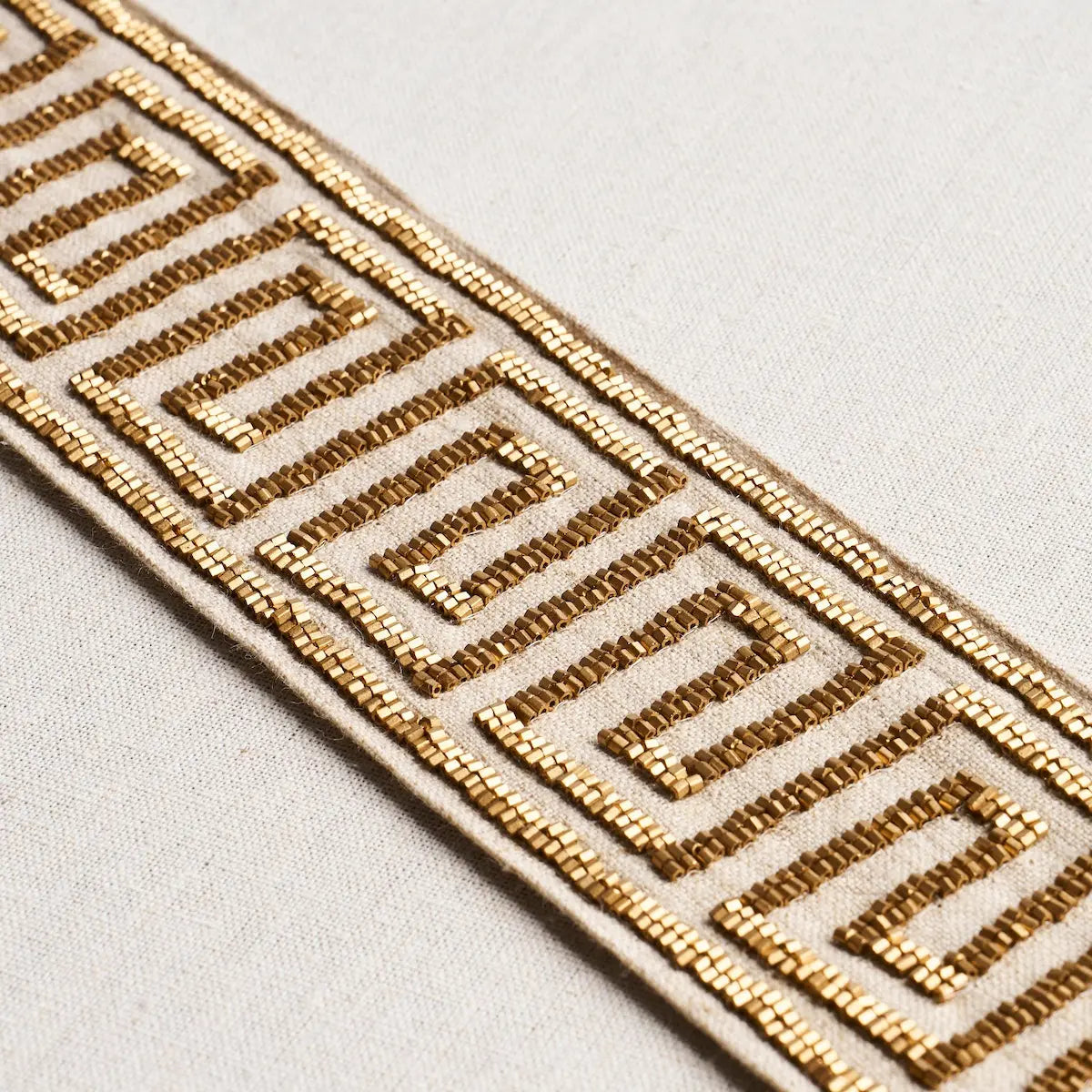 DELPHI-BEADED-TAPE-GOLD-ON-NATURAL-SCHUMACHER-83641